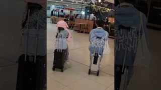 Riding their smart luggage Airwheel suitcase ✌🏽