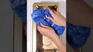 Automatic shoe cover dispenser