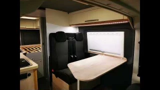 Extra bed in the van from the seating area.